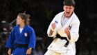 Laura Fazliu of Kosovo (white) celebrates winning over Katarina Kristo of Croatia (blue) during their Women -63kg Semifinal bout of the Judo competitions in the Paris 2024 Olympic Games, at the Champs-de-Mars Arena in Paris, France, 30 July 2024. EPA-EFE/CAROLINE BLUMBERG