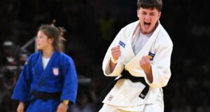 Laura Fazliu of Kosovo (white) celebrates winning over Katarina Kristo of Croatia (blue) during their Women -63kg Semifinal bout of the Judo competitions in the Paris 2024 Olympic Games, at the Champs-de-Mars Arena in Paris, France, 30 July 2024. EPA-EFE/CAROLINE BLUMBERG