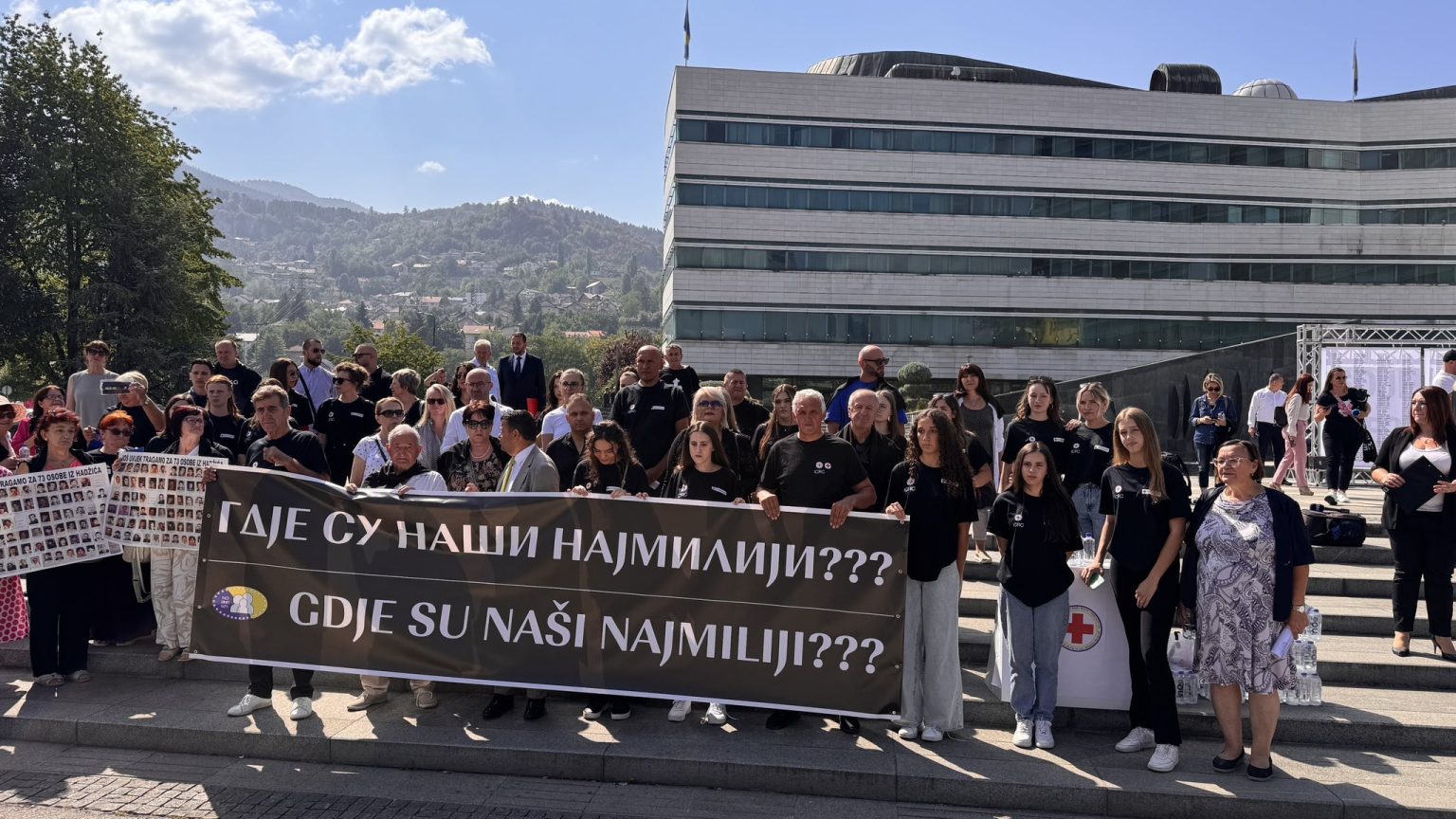 People in Sarajevo hold a banner saying “Where are our loved ones???” Photo: BIRN.