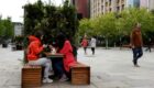 Locals enjoy take away coffee on the main square in Prishtina, Kosovo, 27 May 2020. Photo: EPA/Valdrin Xhemaj