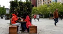 Locals enjoy take away coffee on the main square in Prishtina, Kosovo, 27 May 2020. Photo: EPA/Valdrin Xhemaj