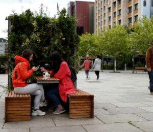 Locals enjoy take away coffee on the main square in Prishtina, Kosovo, 27 May 2020. Photo: EPA/Valdrin Xhemaj