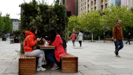 Locals enjoy take away coffee on the main square in Prishtina, Kosovo, 27 May 2020. Photo: EPA/Valdrin Xhemaj