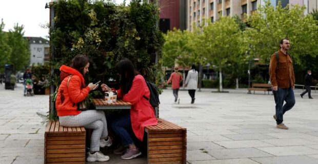 Locals enjoy take away coffee on the main square in Prishtina, Kosovo, 27 May 2020. Photo: EPA/Valdrin Xhemaj