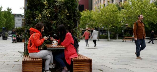Locals enjoy take away coffee on the main square in Prishtina, Kosovo, 27 May 2020. Photo: EPA/Valdrin Xhemaj
