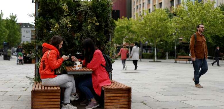 Locals enjoy take away coffee on the main square in Prishtina, Kosovo, 27 May 2020. Photo: EPA/Valdrin Xhemaj