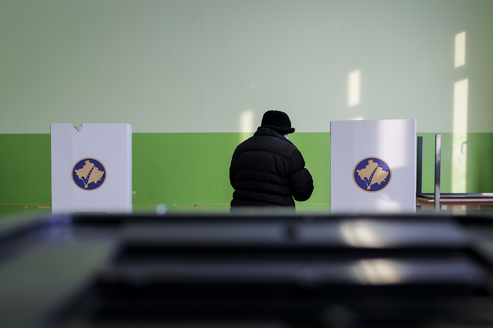 A Kosovo Serb woman prepares to vote at a voting center in Gracanica, Kosovo, 14 February 2021. Kosovo's early parliamentary elections will be held on 14 February 2021. Around 1.8 million voters have the right to cast ballots during snap elections to elect a new 120 seat parliament.  EPA-EFE/VALDRIN XHEMAJ