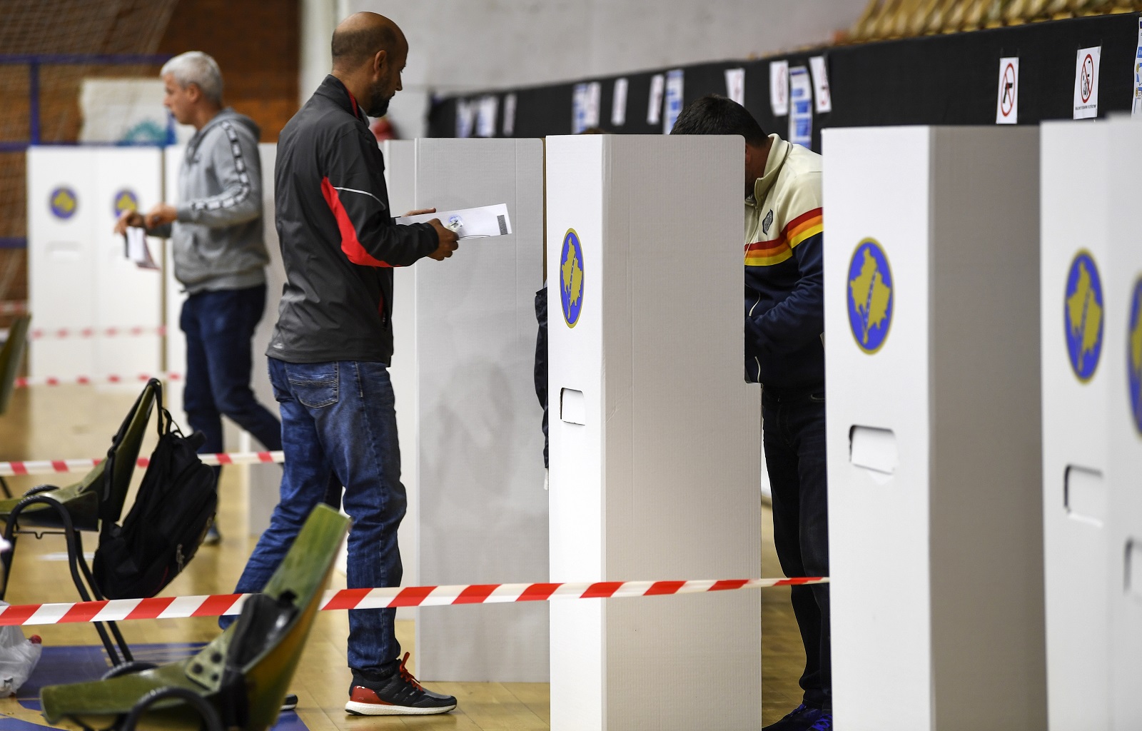 People vote at the polling station during the early parliamentary elections in Pristina, Kosovo, 06 October 2019. About 1.9 million voters are eligible to vote for the 120 seats in Kosovos parliament, 20 of which are reserved for ethnic Serbs and other minorities. Elections have been called in August 2019 after Prime Minister Ramush Haradinaj resigned as Kosovo's prime minister after a war crimes court in The Hague summoned him for questioning as a suspect. EPA-EFE/GEORGI LICOVSKI