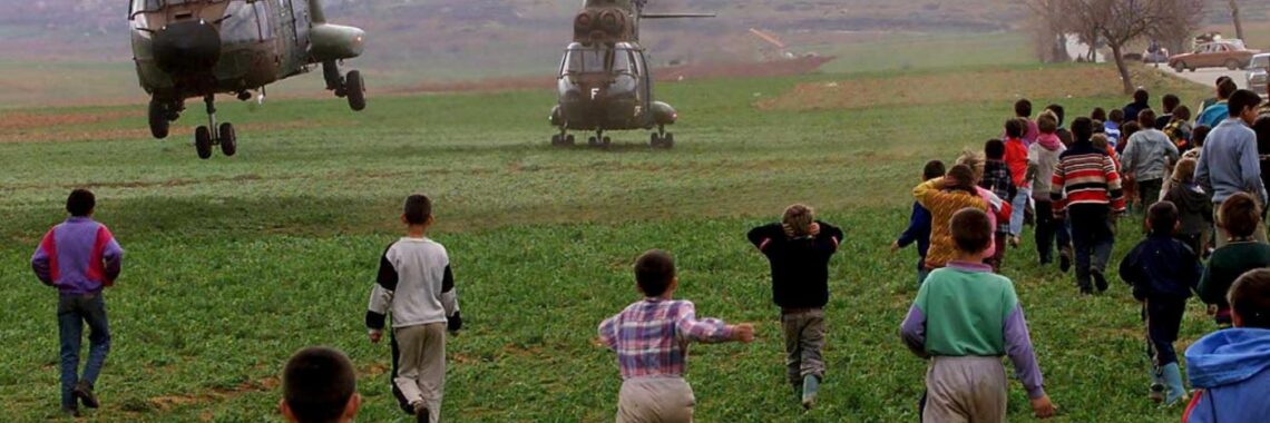 Kosovo Albanian children run towards helicopters bringing humanitarian aid to a refugee camp near Kukes, northern Albania, April 1999. Photo: EPA /ANJA NIEDRINGHAUS/NIE-HH