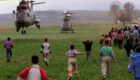 Kosovo Albanian children run towards helicopters bringing humanitarian aid to a refugee camp near Kukes, northern Albania, April 1999. Photo: EPA /ANJA NIEDRINGHAUS/NIE-HH