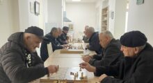 Pensioners play chess at the elderly centre in Prishtina’s Tophane neighbourhood. Photo: BIRN