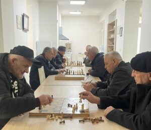 Pensioners play chess at the elderly centre in Prishtina’s Tophane neighbourhood. Photo: BIRN