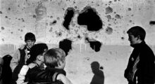 Young boys stand in front of the ruins of Adem Jashari's house, destroyed by Serbian forces in Prekaz. Photo: Joakim Roos