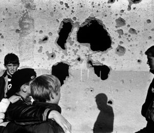 Young boys stand in front of the ruins of Adem Jashari's house, destroyed by Serbian forces in Prekaz. Photo: Joakim Roos