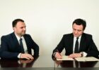 Luan Dalipi (L), Chief of Staff to Kosovo’s Prime Minister, and Prime Minister Albin Kurti (R) sign the cabinet joining agreement on February 21, 2020. Photo: Prime Minister’s Official Facebook Account