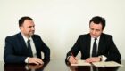 Luan Dalipi (L), Chief of Staff to Kosovo’s Prime Minister, and Prime Minister Albin Kurti (R) sign the cabinet joining agreement on February 21, 2020. Photo: Prime Minister’s Official Facebook Account