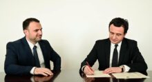 Luan Dalipi (L), Chief of Staff to Kosovo’s Prime Minister, and Prime Minister Albin Kurti (R) sign the cabinet joining agreement on February 21, 2020. Photo: Prime Minister’s Official Facebook Account