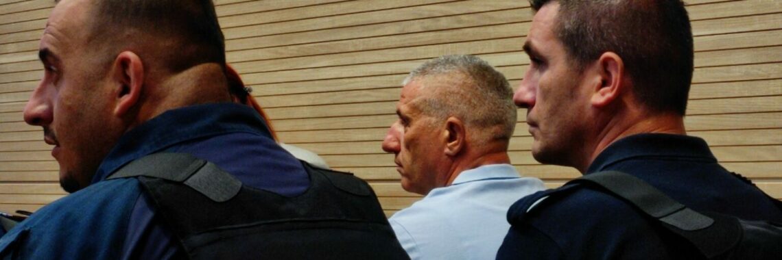 Caslav Jolic (middle) at Prishtina Basic Court. Photo: BIRN.