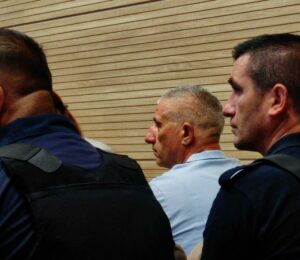 Caslav Jolic (middle) at Prishtina Basic Court. Photo: BIRN.