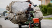 Roma men transport large bags with garbage on World Environment Day, in Mitrovica, Kosovo, 05 June 2017. Photo: EPA/VALDRIN XHEMAJ