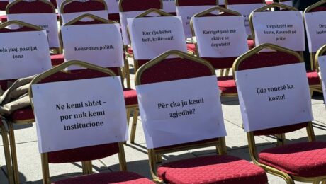 Activists place empty chairs with calls to Kosovo MPs to end the blockage of the parliament in protest, May 27, 2025. Photo: BIRN