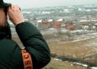 An OSCE officer checks the Studencane and Suva Reka area in Kosovo, February 1999. Photo: EPA/ATTILA KISBENEDEK/STF/AK/CL/OW.