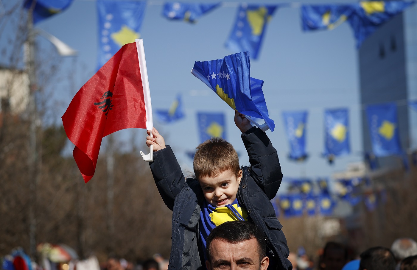 A Kosovo Albanian waves Albanian and Kosovo national flags during a ceremony to mark the 12th anniversary of Kosovo's independence in Pristina, Kosovo, February 17, 2020. Photo: EPA/VALDRIN XHEMAJ