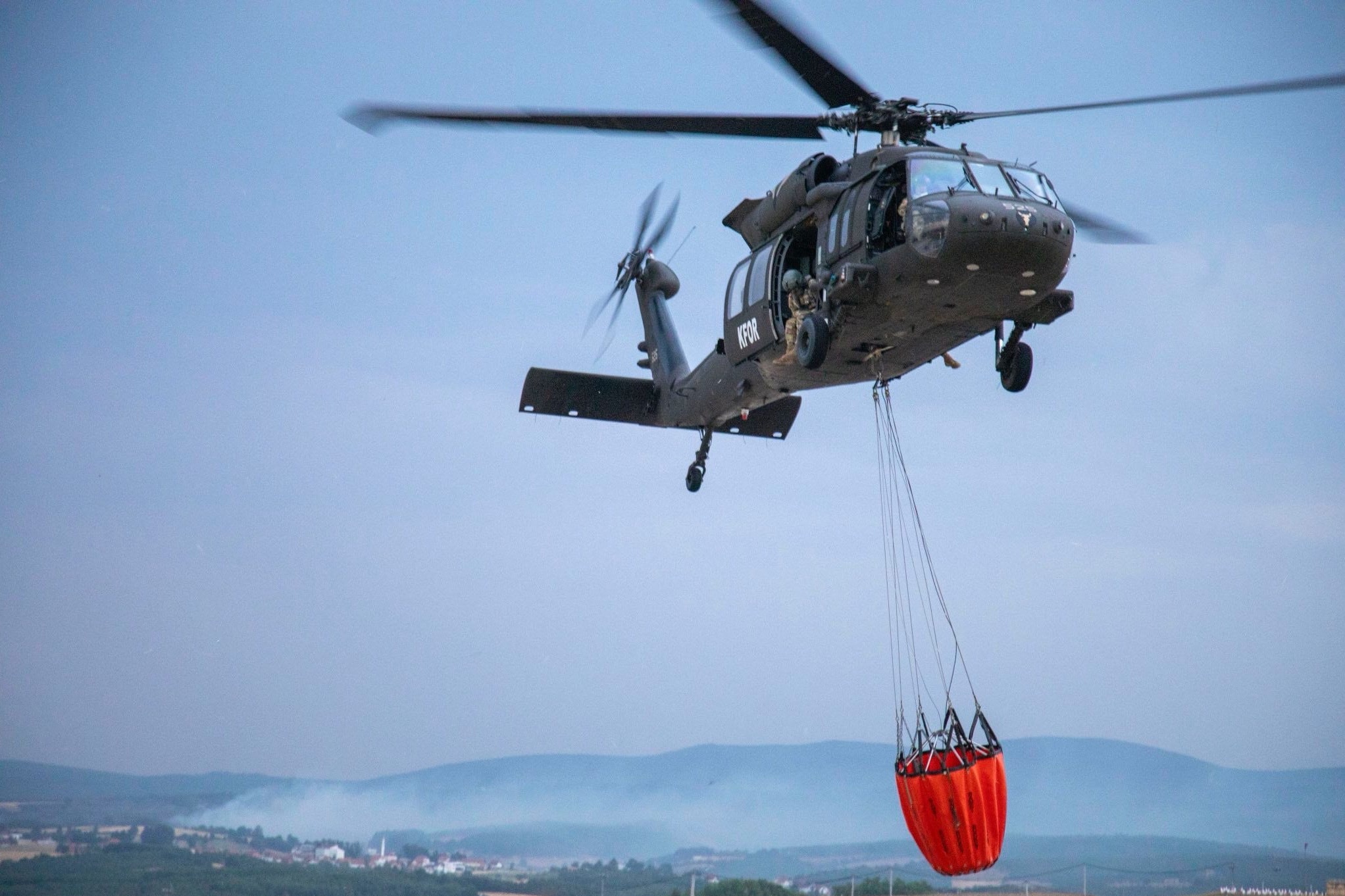 The NATO-led KFOR mission troops assist the Kosovo Emergency Management Agency in combating wildfires on July 28. Photo: NATO Kosovo Force-KFOR