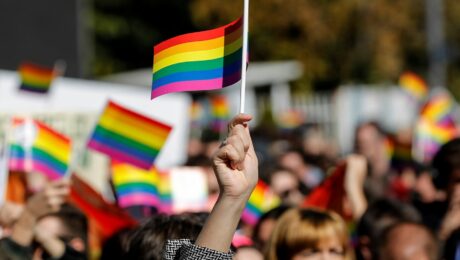 Participants wave rainbow flags as they join (LGBTIQ+) rights groups during Kosovo's first pride parade in October 2017. Photo: EPA/VALDRIN XHEMAJ