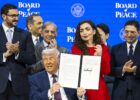 US President Donald Trump (C) holds a signed founding charter at the 'Board of Peace' meeting during the 56th annual meeting of the World Economic Forum (WEF), in Davos, Switzerland, 22 January 2026. Photo: EPA/Gian Ehrenzeller