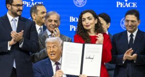 US President Donald Trump (C) holds a signed founding charter at the 'Board of Peace' meeting during the 56th annual meeting of the World Economic Forum (WEF), in Davos, Switzerland, 22 January 2026. Photo: EPA/Gian Ehrenzeller