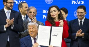 US President Donald Trump (C) holds a signed founding charter at the 'Board of Peace' meeting during the 56th annual meeting of the World Economic Forum (WEF), in Davos, Switzerland, 22 January 2026. Photo: EPA/Gian Ehrenzeller