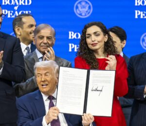 US President Donald Trump (C) holds a signed founding charter at the 'Board of Peace' meeting during the 56th annual meeting of the World Economic Forum (WEF), in Davos, Switzerland, 22 January 2026. Photo: EPA/Gian Ehrenzeller