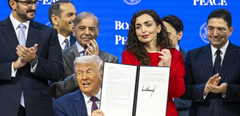 US President Donald Trump (C) holds a signed founding charter at the 'Board of Peace' meeting during the 56th annual meeting of the World Economic Forum (WEF), in Davos, Switzerland, 22 January 2026. Photo: EPA/Gian Ehrenzeller