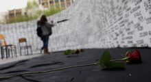 Kosovo Albanian women look at the names of missing people, written on a wall in Prishtina, Kosovo, on the day of missing persons from Kosovo 1998-99 war, on April 27, 2011. Photo from the archives: EPA/Valdrin Xhemaj