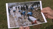 Gani Kosumi holds his photograph showing footballers having a wash in a stream after a match in March 1997. Photo: BIRN.