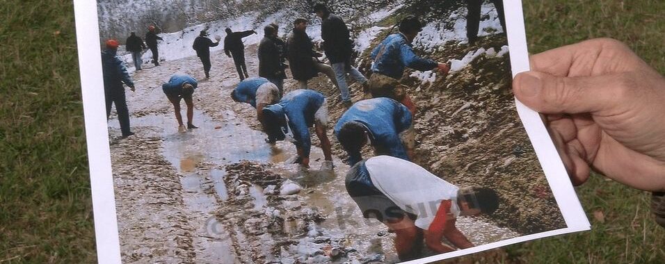Gani Kosumi holds his photograph showing footballers having a wash in a stream after a match in March 1997. Photo: BIRN.